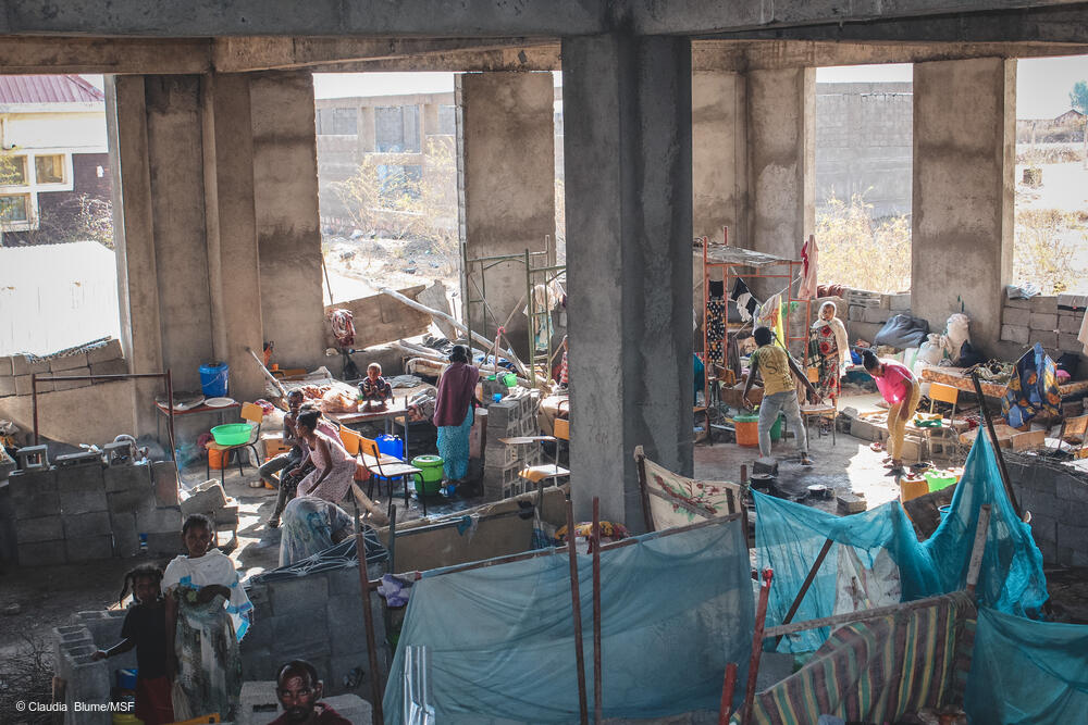 msb58245_medium.jpg Hundreds of people in Shire’s University IDP site live in an unfinished building, where they sleep, cook and eat.