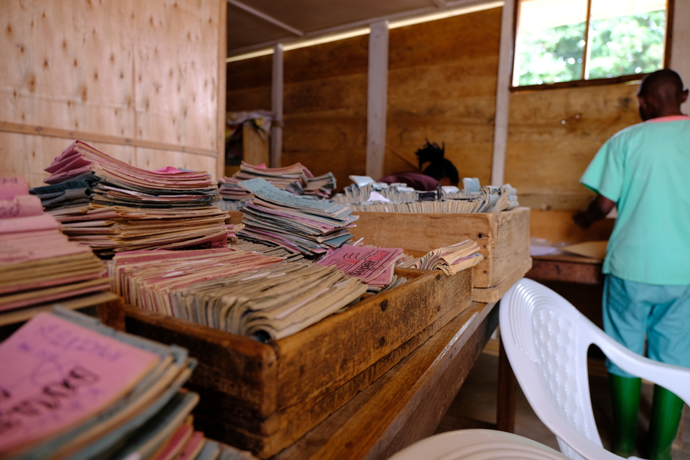 Patient records at the MSF-supported health center of Boikene. Amidst the Ebola response, urgent primary health care services are at risk of being neglected. [© Samuel Sieber/MSF]