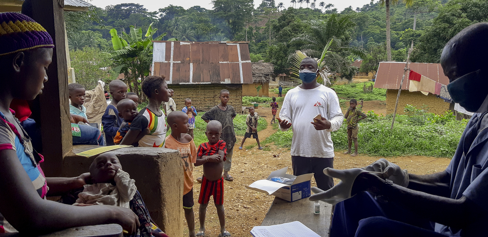 msf323315_medium.jpg MSF health promoter Mohammed Turay delivers a health sensitisation session as people wait to be seen by a community health worker in the village of Mbaama, Kenema District