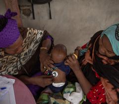 Nurse Ndoungamandji Solange, examines a child in Massakori, Chad