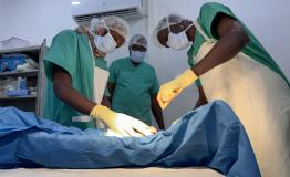 3 Sudanese Colleagues perform a follow-up surgery on a patient amputation