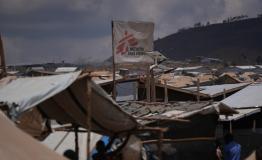 An MSF flag marks a health post in the Busuma refugee camp in Burundi. The camp is facing a critical shortage of humanitarian support, and some organisations risk having to withdraw by the end of the year due to a lack of funding.