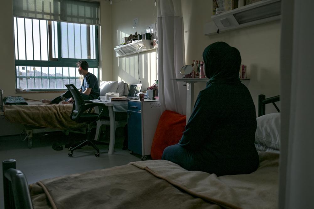 Iyad looks out the window of his room at the MSF reconstructive surgery hospital in Amman, Jordan.