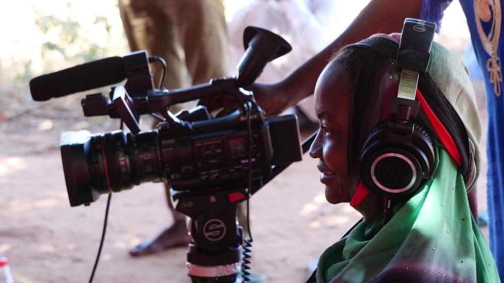 A woman filming in a community project in Sila, eastern Chad