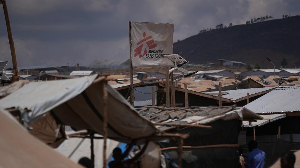 An MSF flag marks a health post in the Busuma refugee camp in Burundi. The camp is facing a critical shortage of humanitarian support, and some organisations risk having to withdraw by the end of the year due to a lack of funding.