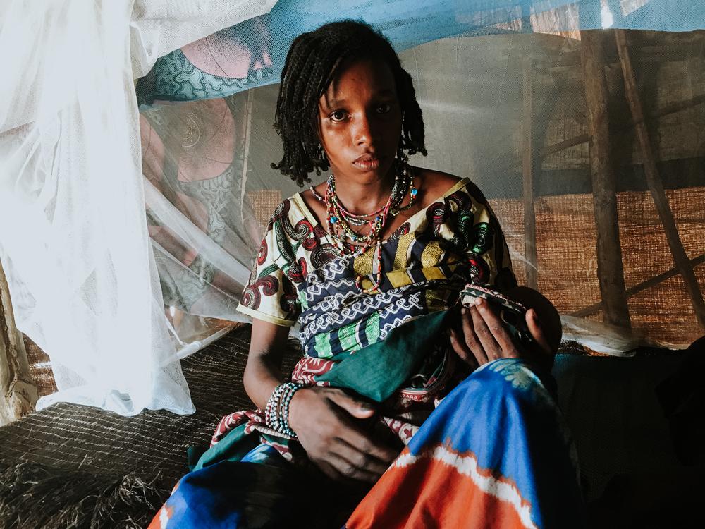 Mariam gave birth to her son Isyaka while fleeing her village,