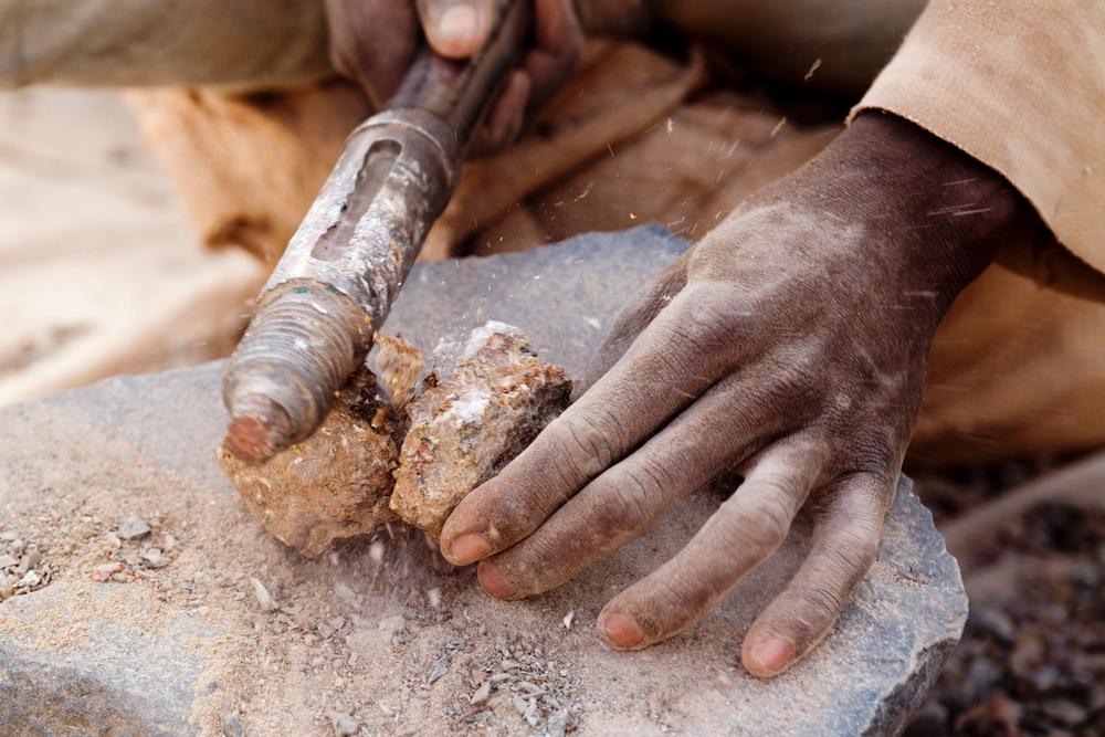Stone crushing at Bagega gold processing site, Zamfara state, Nigeria. A pilot program to introduce safer mining practices in Nigerian gold mining communities has reduced blood lead levels by 32% [Photo: Olga Overbeek ] 