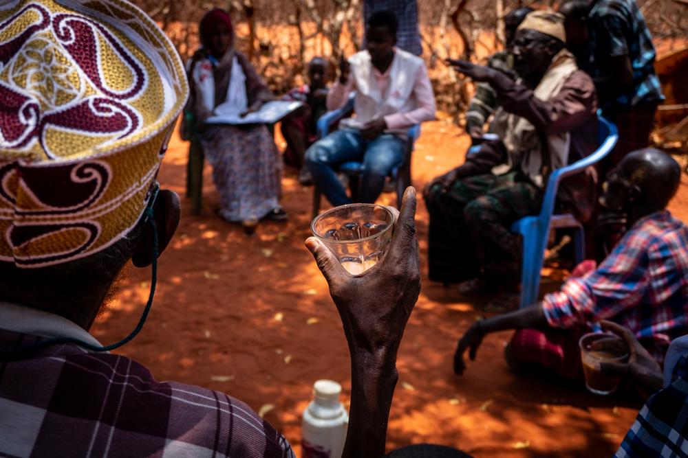 . The MSF tea team chats with community leaders and elders of Kurtunle village during the monthly tea team focus group meeting  [ © Susanne Doettling / MSF ] 