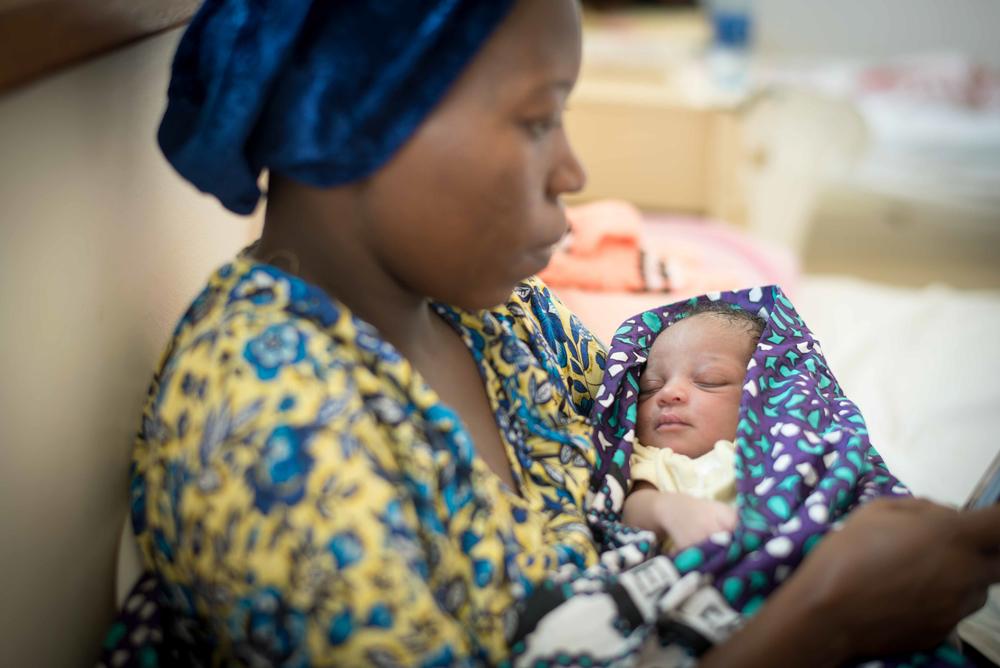 A mother with her new-born in Mrima Hospital 