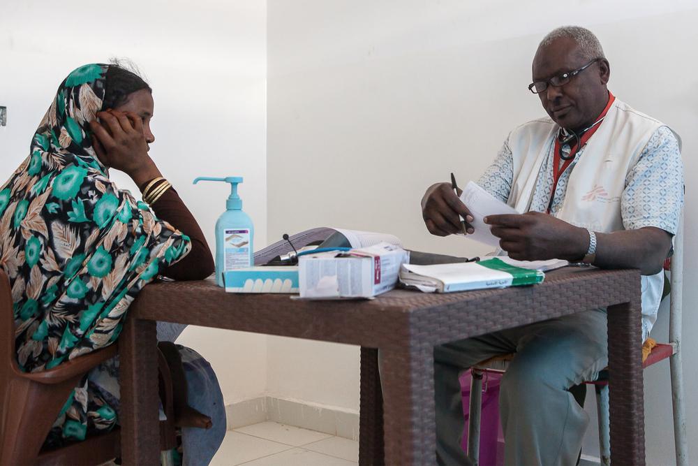 Nutrition assistant prepares a prescription for a woman in Al Kashafa 
