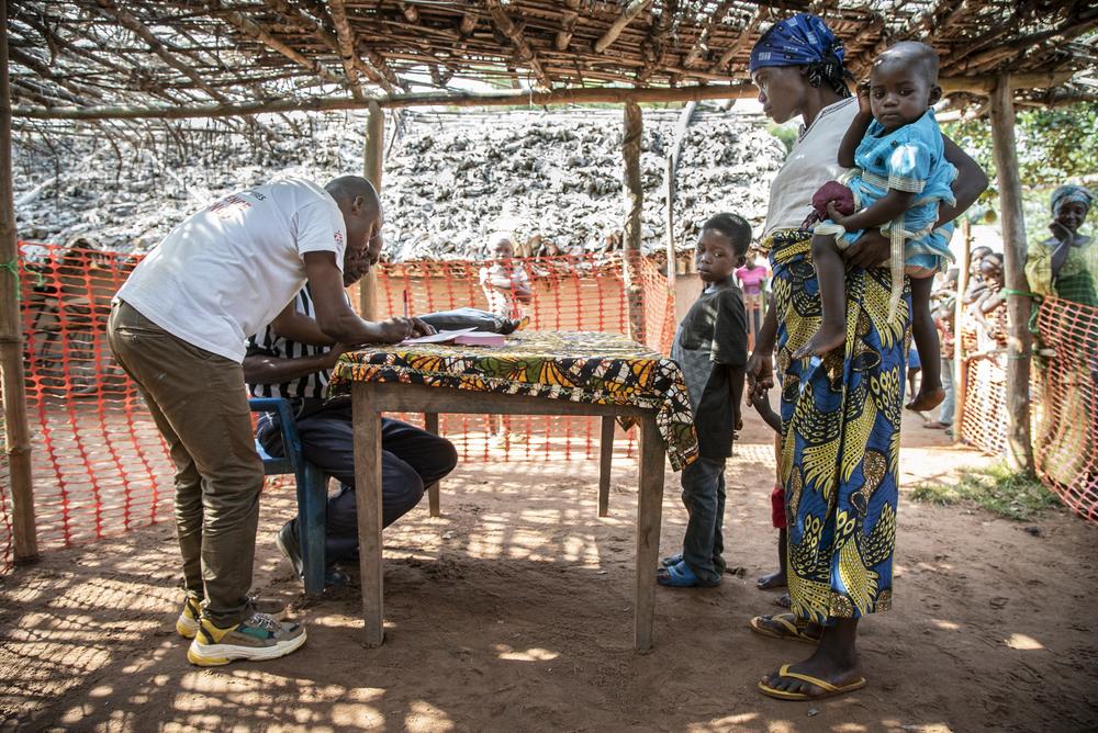 Families register for the measles vaccination campaign in  Botulu, Boso Manzi health zone