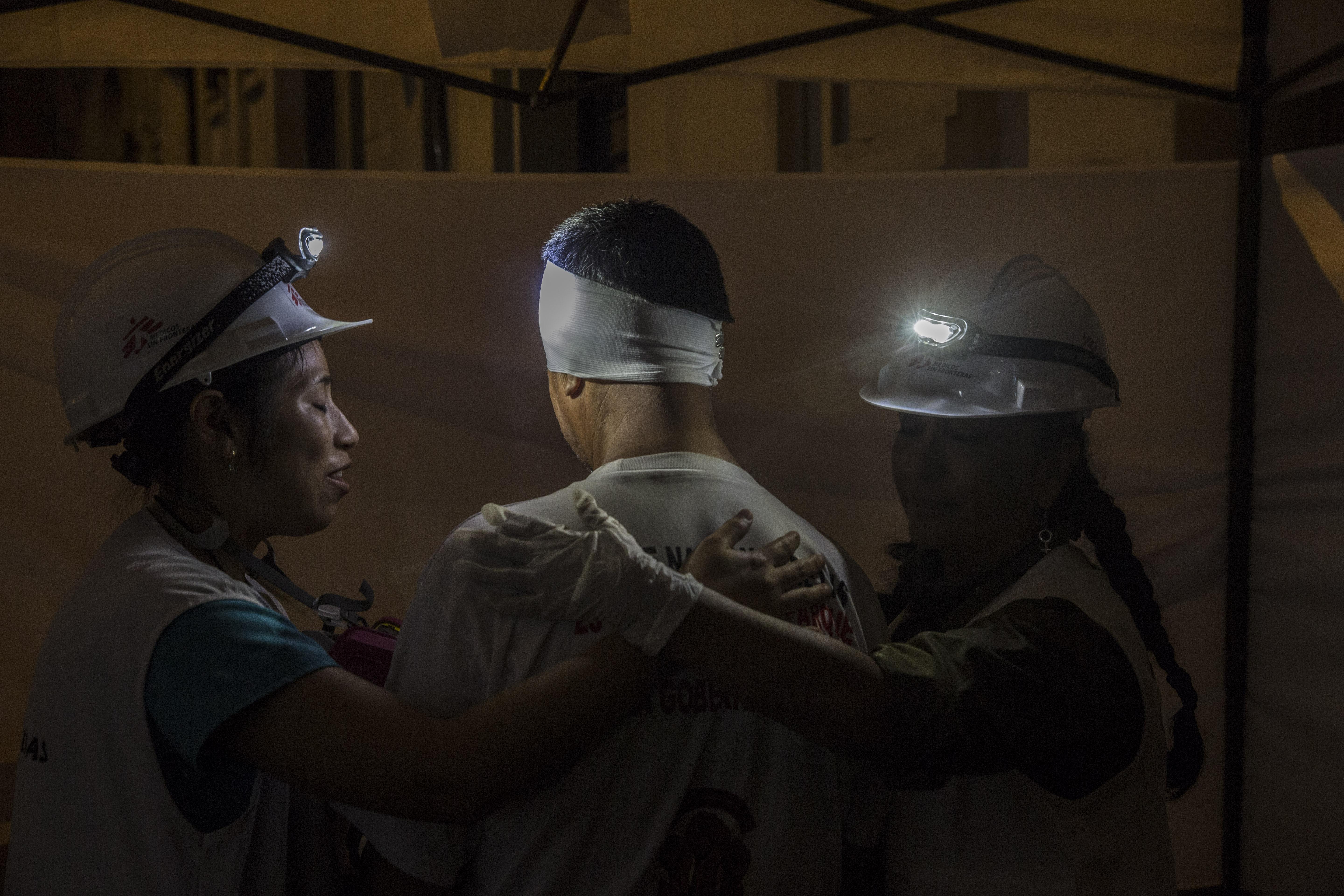 Treating people injured during the protests in Lima