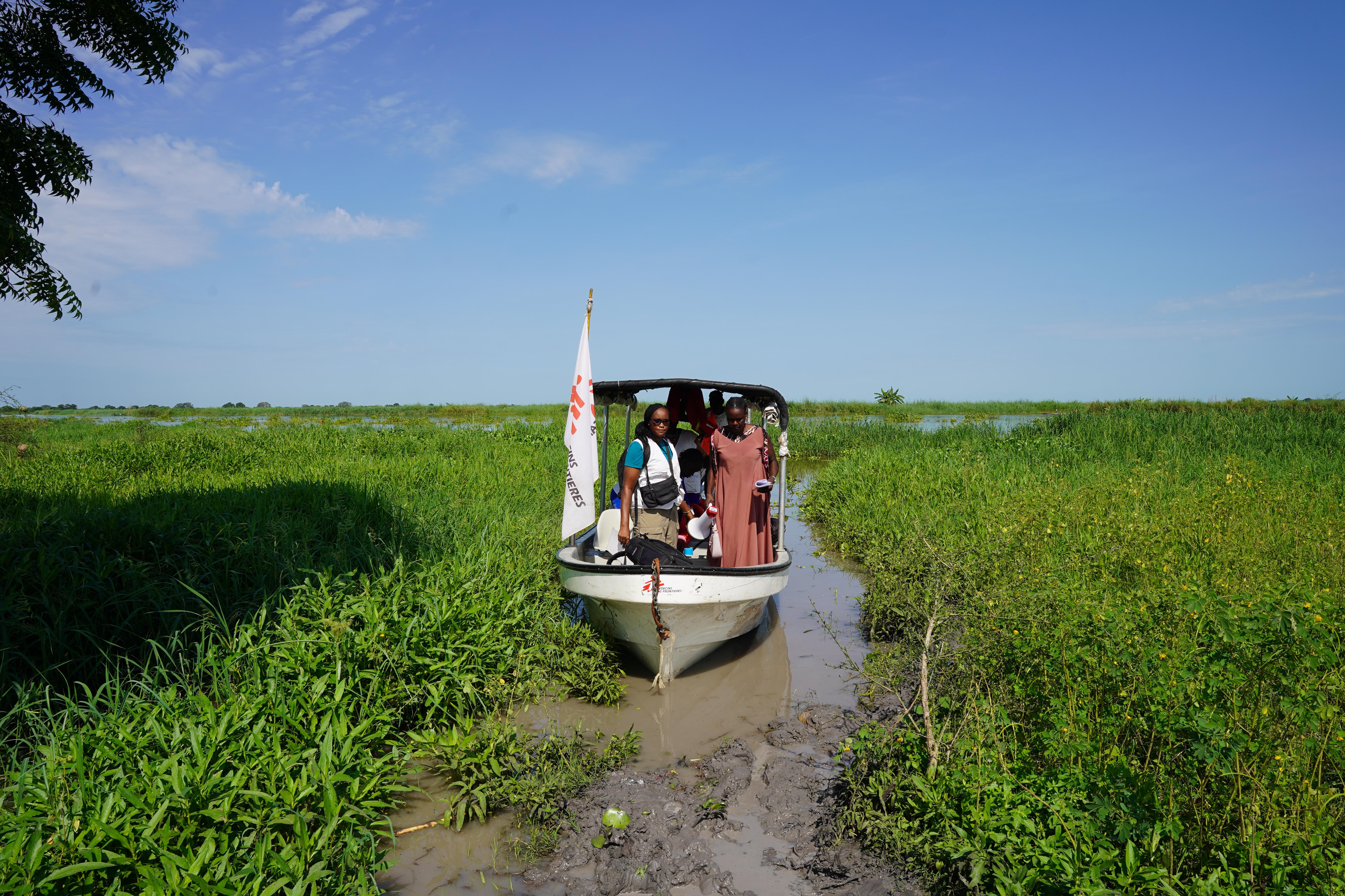 MSF outreach team traveling by boat to a remote village
