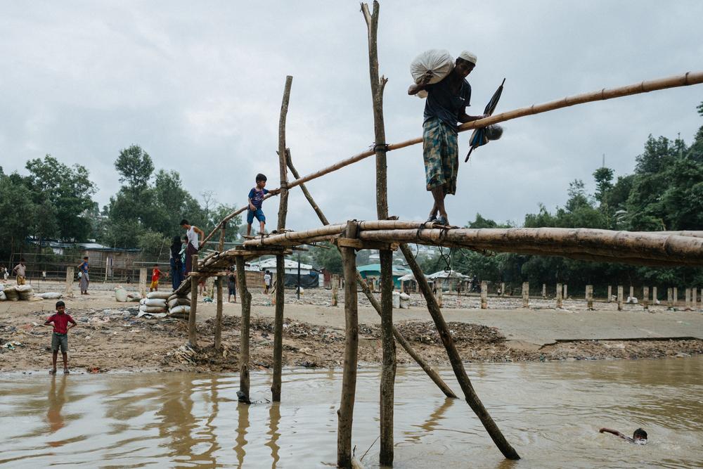 A bridge crossing separates camp districts in Kutapalong refugee camp, Bangladesh, June 2025.