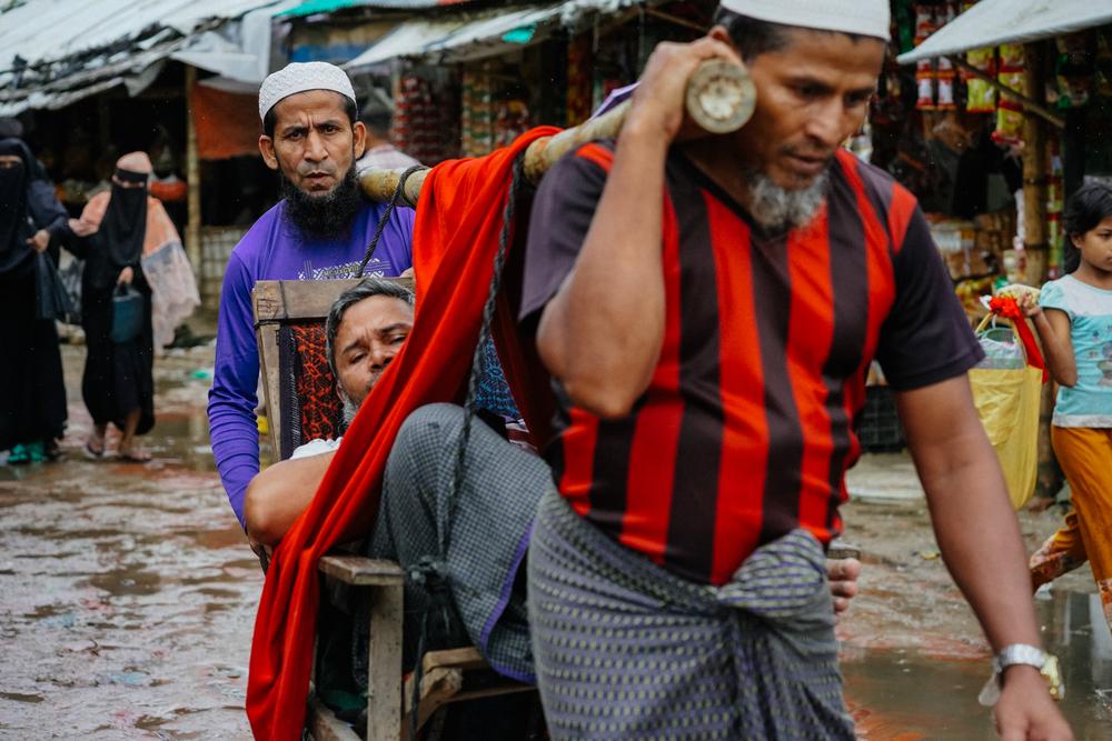 A man is transported to a health facility. Bangladesh, June 2025.