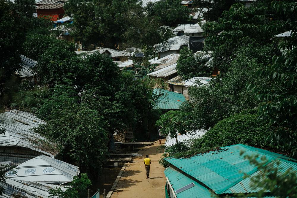 A lone Rohingya man walks through the Kutapalong refugee camps