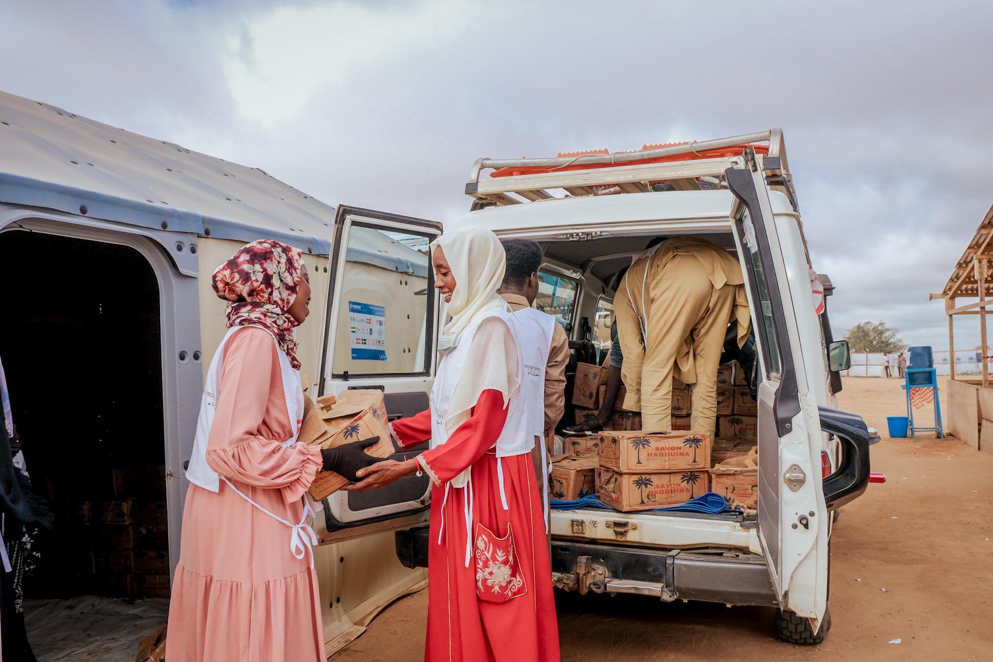 Smira Abakar Nahar Gria and Madiha Haroon Ali Ishag, daily workers with MSF, participate in a soap distribution to prevent and control cholera in Adré, eastern Chad. 6,528 kits containing 75 bars of soap were distributed. Each person received three bars of soap.