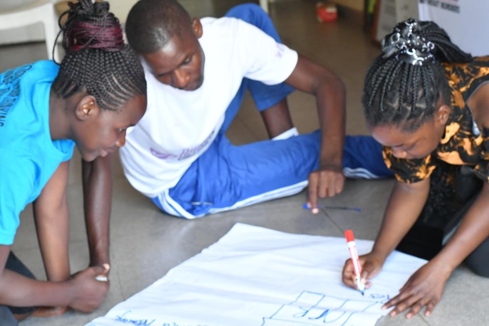 Mirabelle Gavi and other members of the Adolescent Advisory Committee during a review and planning session in Mbare.
