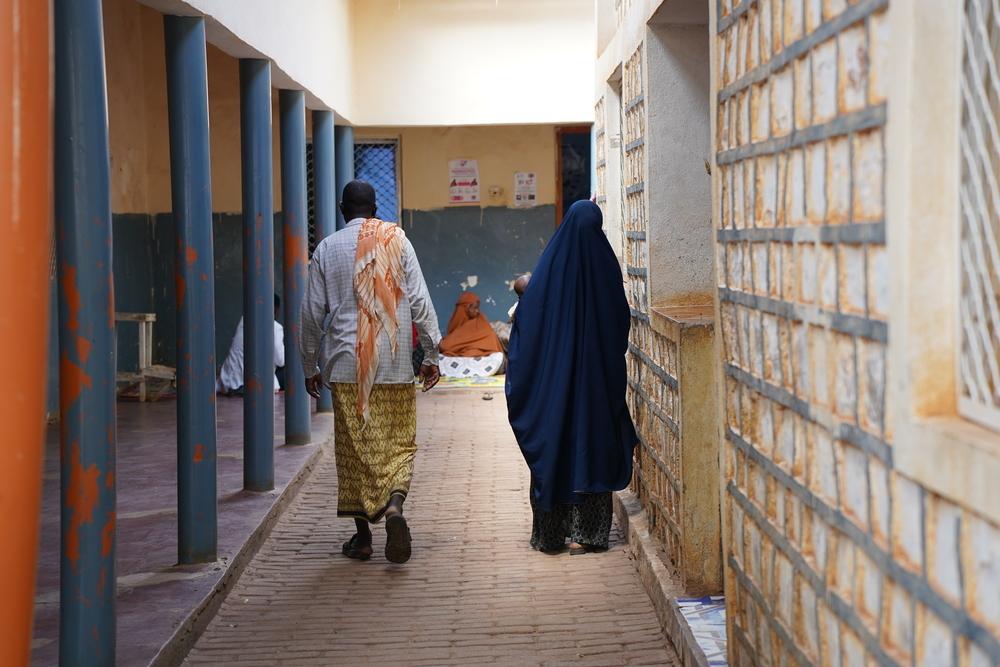 A couple walks through the corridor of MSF supported Bay Regional Hospital in Baidoa, Somalia