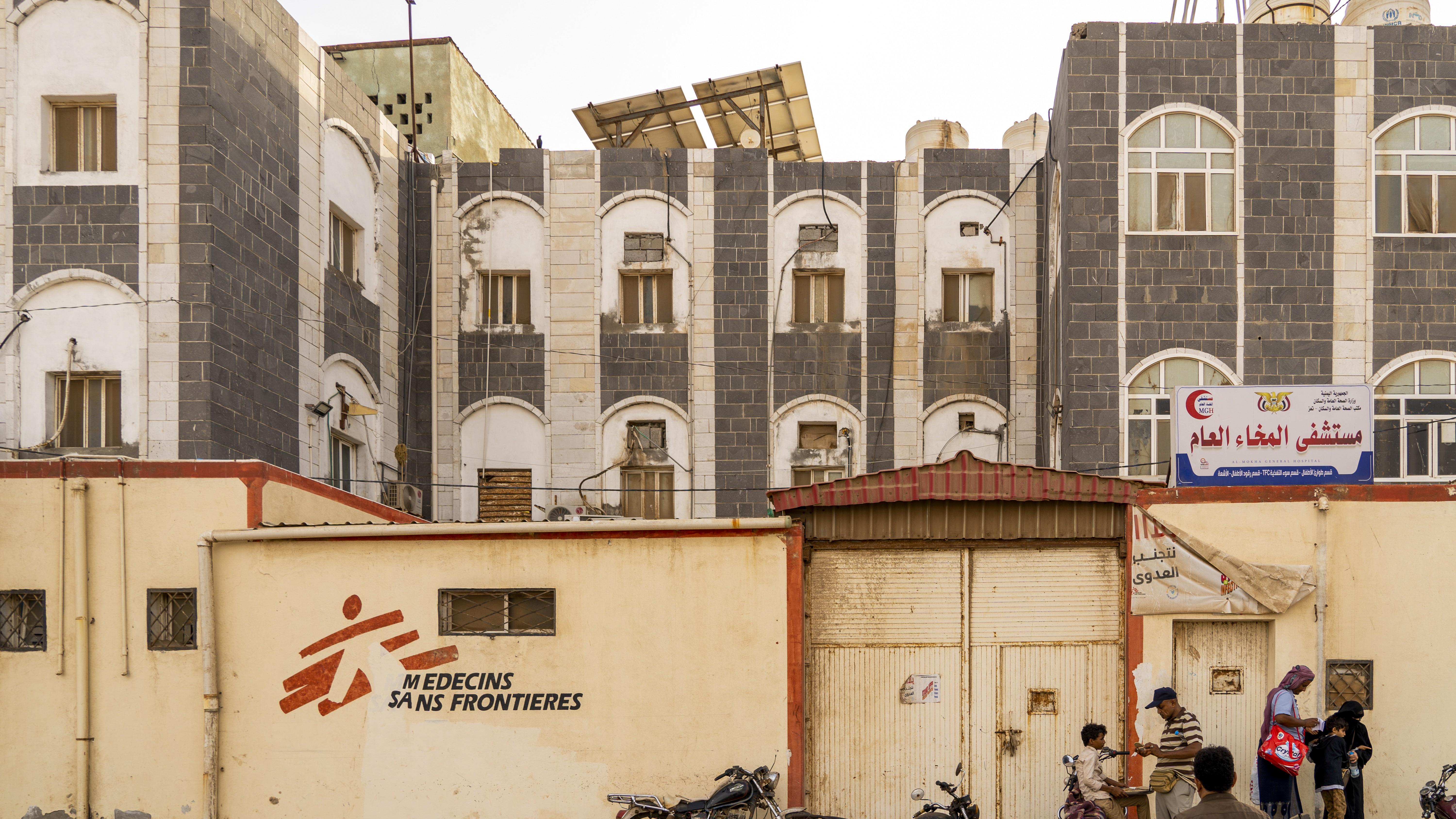 People pass the entrance of Mocha General Hospital in Mocha, Taiz governorate, Yemen, 14 May 2026. MSF increased isolation capacity at the hospital in April 2026 to help manage the rise in children needing care for measles.