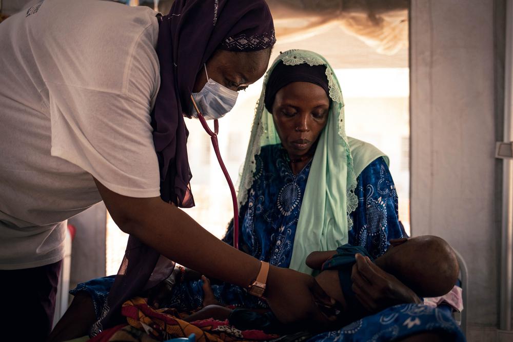 An MSF doctor examines Mahamat Alhabib, 10 months old, who was admitted to the measles isolation unit supported by MSF and is also being treated for malnutrition at the Am Timan Hospital.