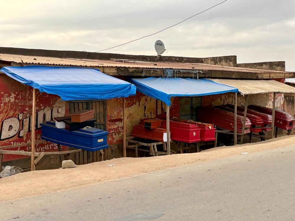 Empty coffins are on display for sale along a road in Bunia, Ituri, in the Democratic Republic of the Congo.
