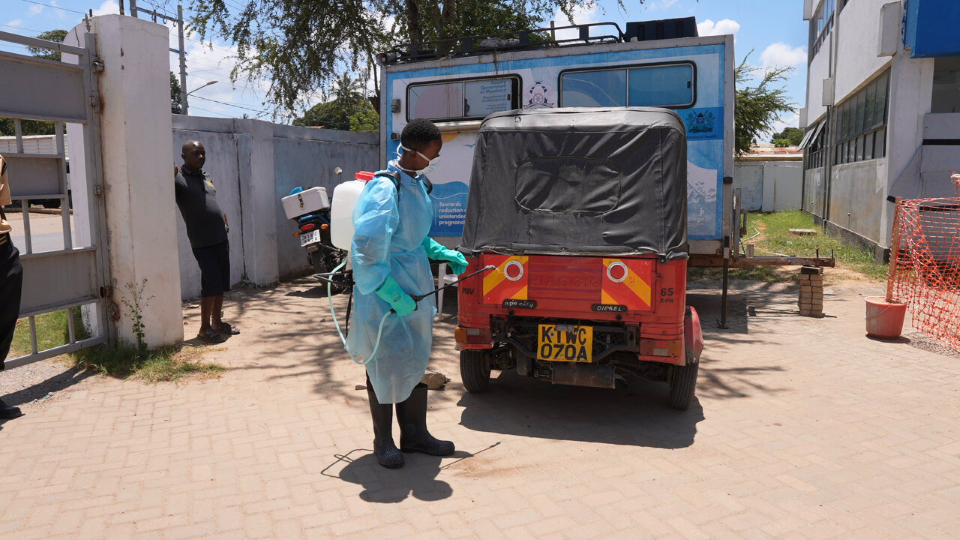 Mwachiro Ngala Mangale, hygeinist disinfecting a Tuktuk after it brought in a suspected MPOX patient