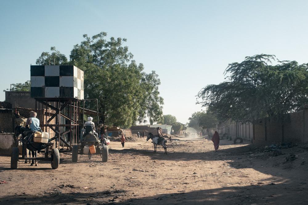 Donkey carts used by water vendors fill their tanks at a water point in Adré, eastern Chad, near the Sudanese border.