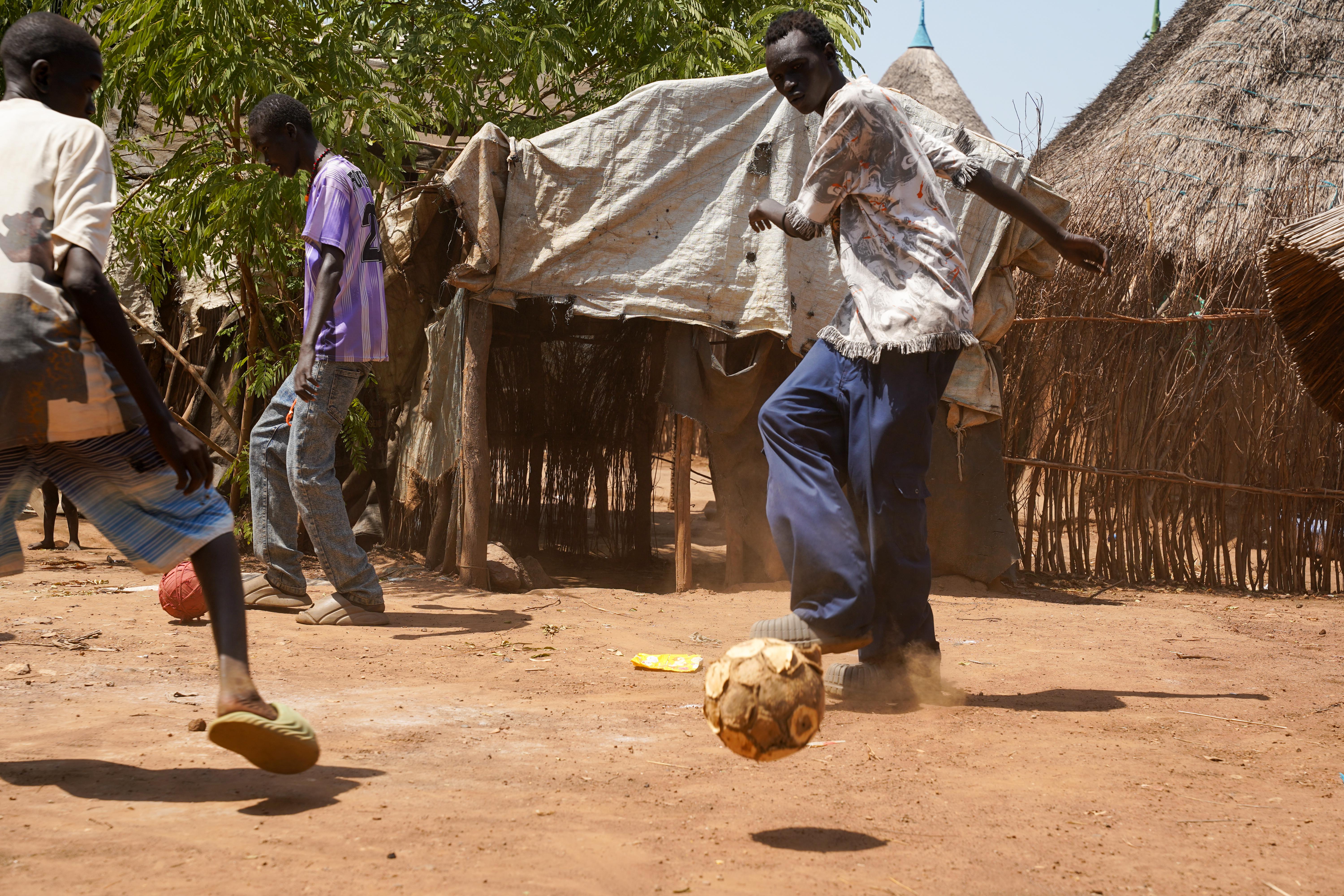 Kan, 19 years old South Sudanese refugee living in Kule Refugee Camp since he was 7. Gambella region, Ethiopia, 2026. Kan playing football.