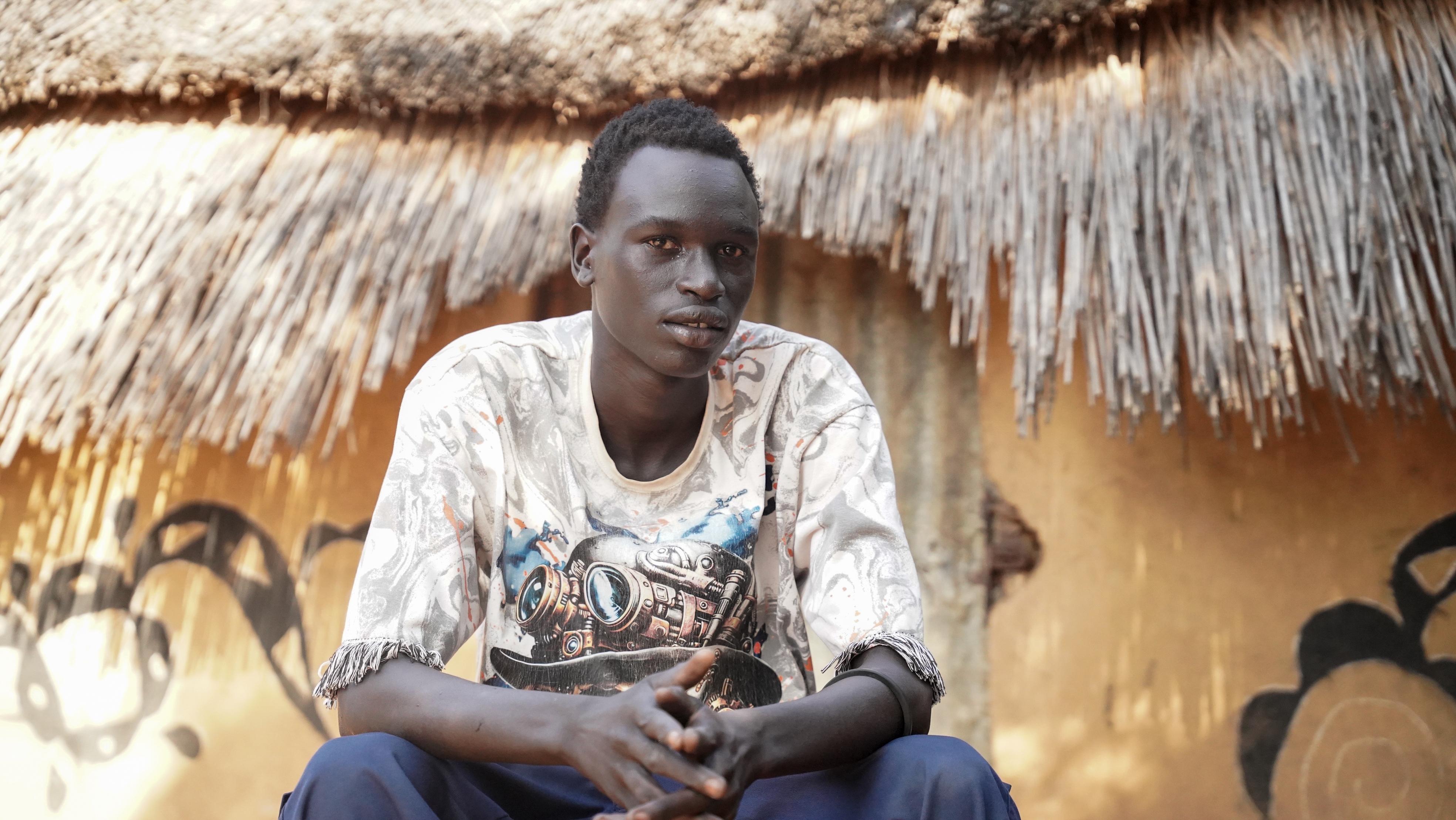 Kan, 19 years old South Sudanese refugee living in Kule Refugee Camp since he was 7. Gambella region, Ethiopia, 2026.