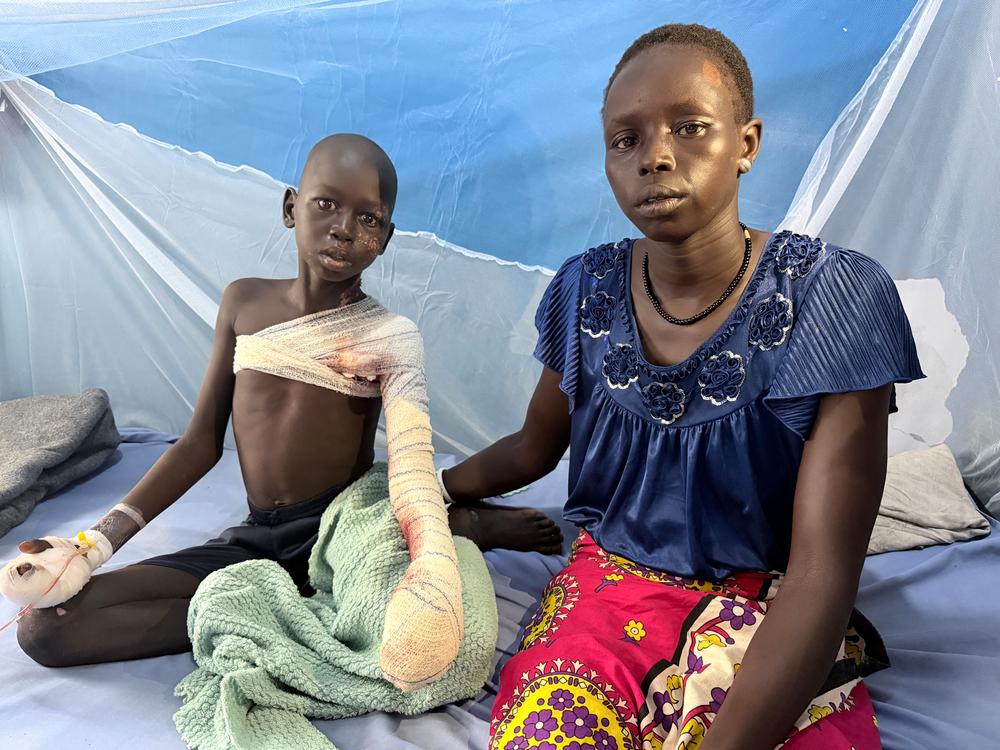 Mamouch (13) and his mother Nyareu in the paediatric ward at Malakal Teaching Hospital, Upper Nile State Hospital, South Sudan.