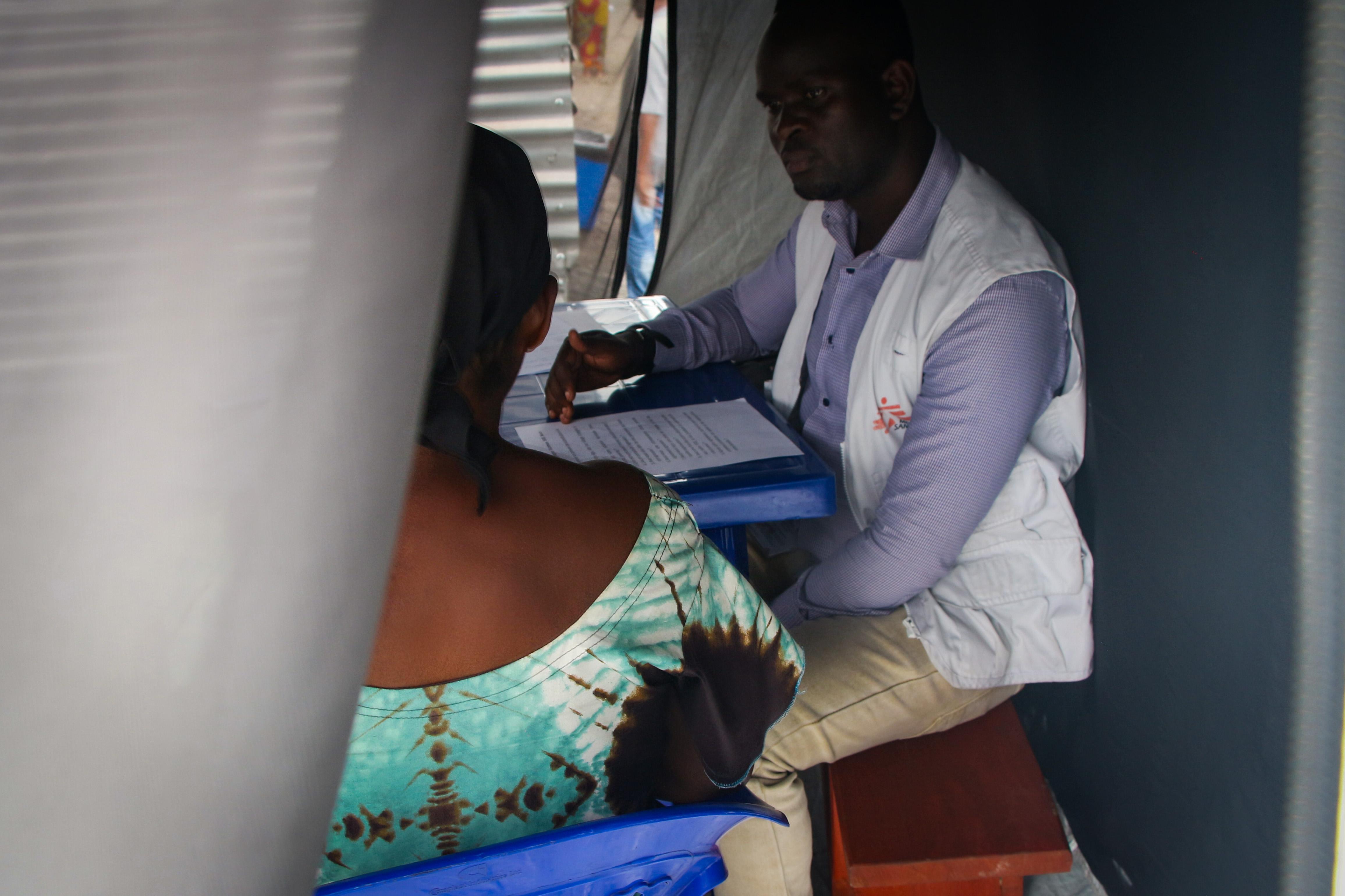 MSF psychologist Jean speaks with a survivor of sexual violence during a consultation at Mungunga 3 health centre in Goma, Eastern DRC.